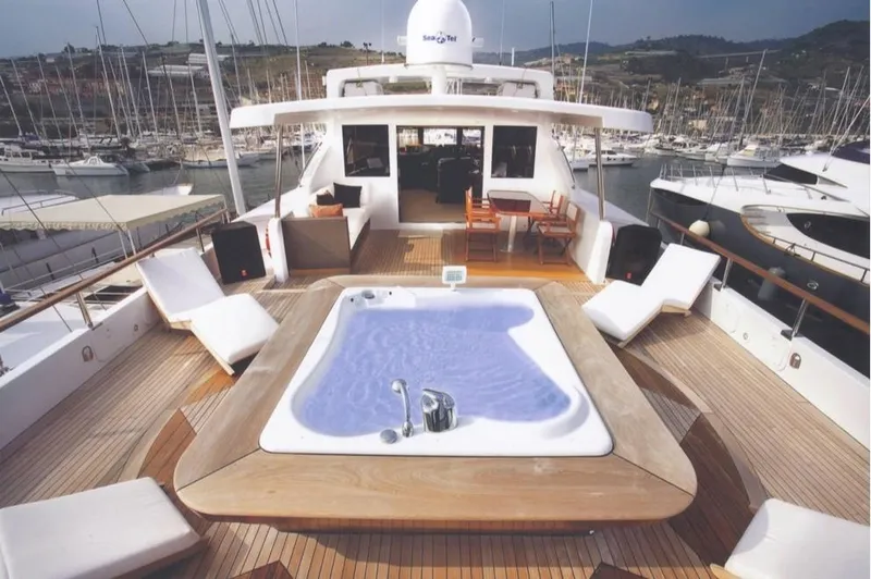  Yacht Photos Pics Luxurious 2001 Castagnola 30 mt yacht with jacuzzi and sun loungers on deck.