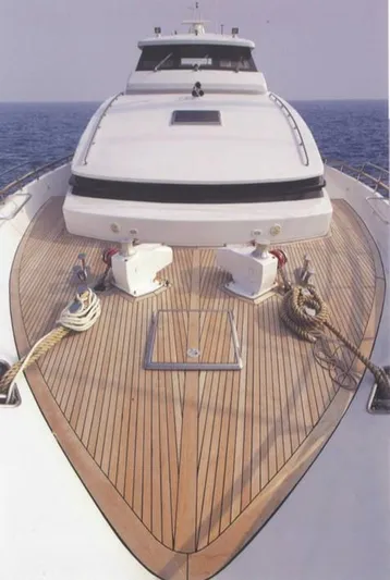  Yacht Photos Pics Luxury Castagnola 30 mt yacht, 2001 model, with sleek wooden deck and ocean backdrop.