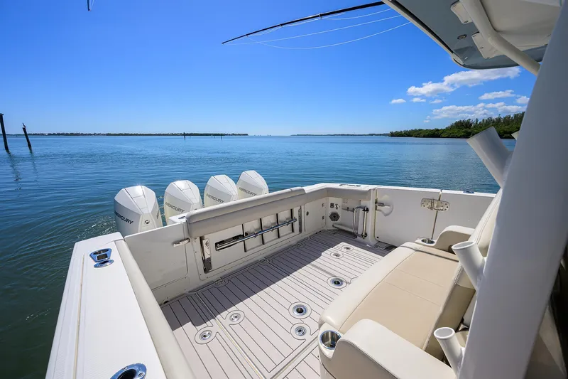 Who's Sippin Yacht Photos Pics 2021 Boston Whaler 380 Outrage boat deck with ocean view and clear blue sky.