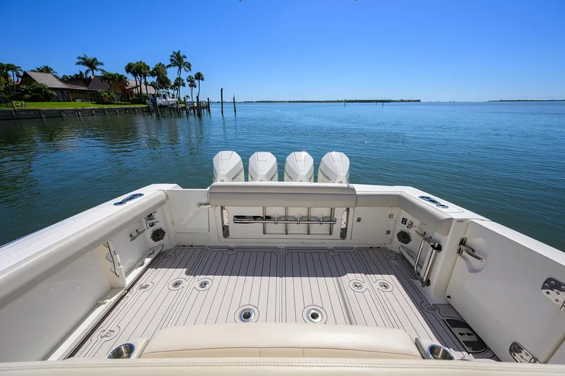 Who's Sippin Yacht Photos Pics 2021 Boston Whaler 380 Outrage boat deck with ocean view and clear blue sky.