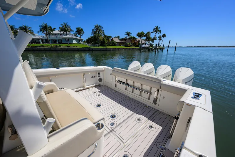 Who's Sippin Yacht Photos Pics 2021 Boston Whaler 380 Outrage boat deck with scenic waterfront view.