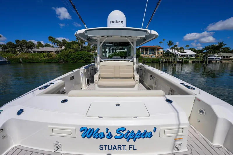 Who's Sippin Yacht Photos Pics 2021 Boston Whaler 380 Outrage boat docked in Stuart, FL, with clear skies.