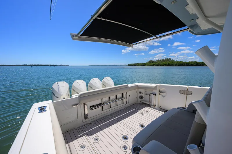 Who's Sippin Yacht Photos Pics Boston Whaler 380 Outrage 2021 boat deck with ocean view and canopy.
