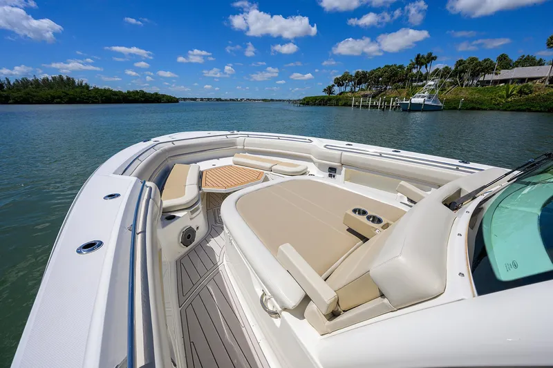 Who's Sippin Yacht Photos Pics 2021 Boston Whaler 380 Outrage boat with luxurious seating on a sunny day.