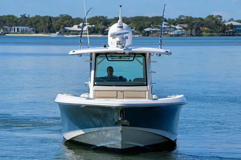 Who's Sippin Yacht Photos Pics 2021 Boston Whaler 380 Outrage boat on calm water, front view.