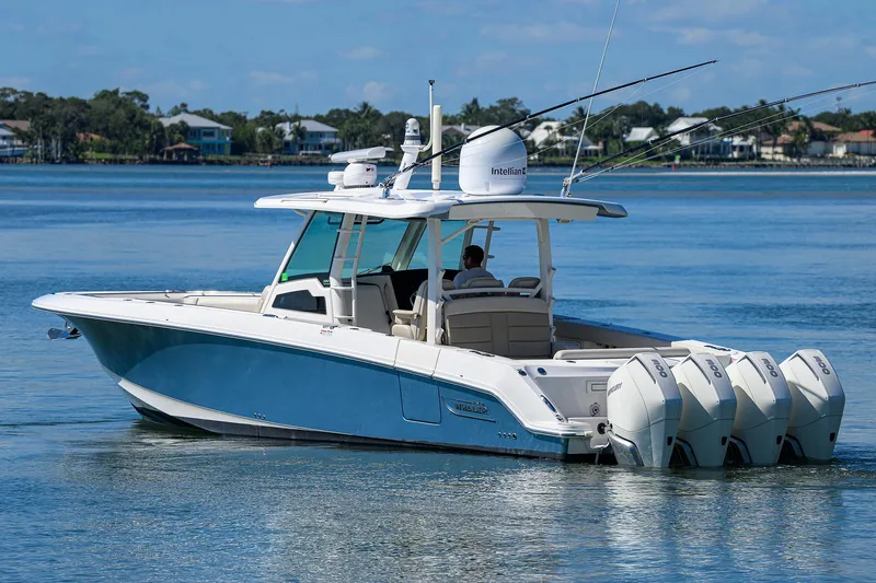 Who's Sippin Yacht Photos Pics 2021 Boston Whaler 380 Outrage boat cruising on calm waters with four engines.