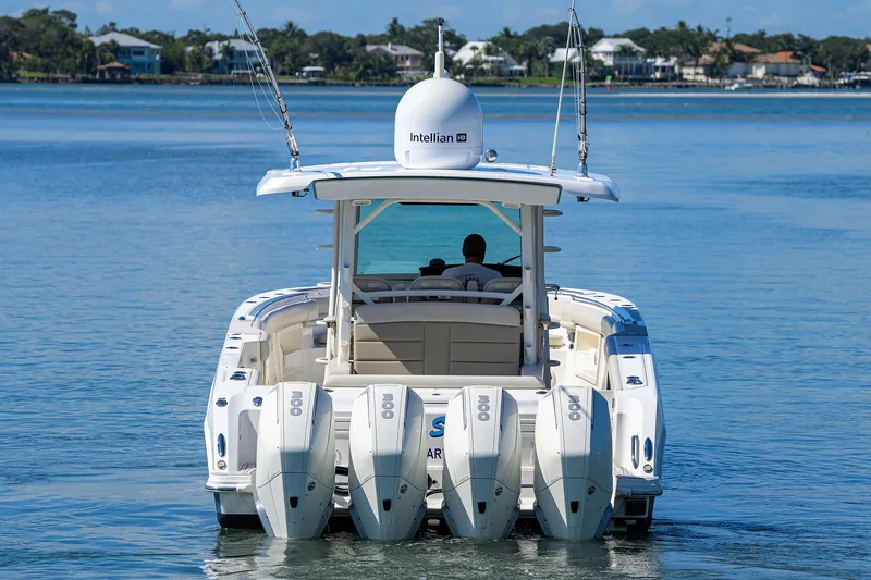 Who's Sippin Yacht Photos Pics 2021 Boston Whaler 380 Outrage boat with multiple engines on calm water.