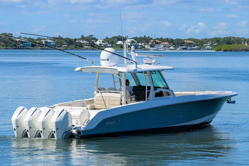 Who's Sippin Yacht Photos Pics 2021 Boston Whaler 380 Outrage boat on calm water, featuring multiple outboard engines.