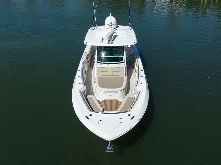 Who's Sippin Yacht Photos Pics 2021 Boston Whaler 380 Outrage boat on calm water, aerial view.
