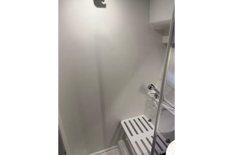  Yacht Photos Pics Bathroom interior of 2023 Jeanneau NC 1095 boat, featuring modern fixtures and sleek design.