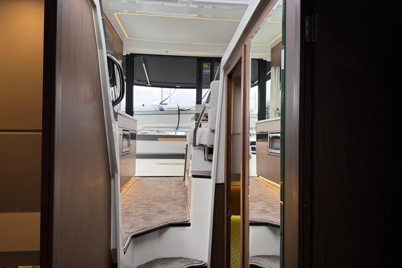  Yacht Photos Pics Interior view of 2023 Jeanneau NC 1095 yacht, showcasing modern design and luxurious finishes.