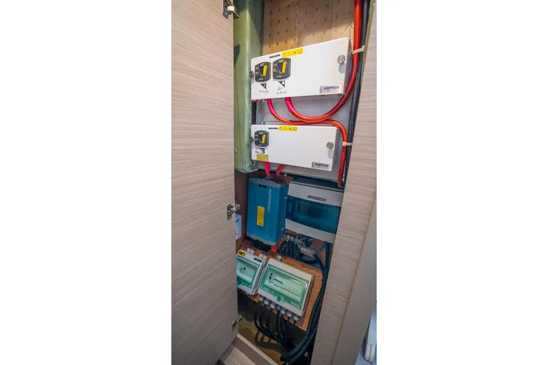 Tide Together Yacht Photos Pics Electrical panel inside 2023 Lagoon 42 yacht, featuring wiring and control systems.