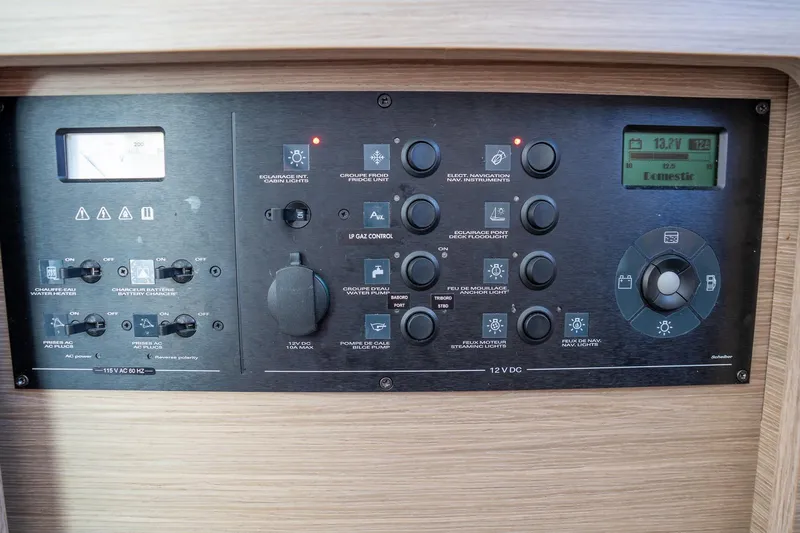 Tide Together Yacht Photos Pics Control panel of a 2023 Lagoon 42 yacht, featuring various switches and indicators.