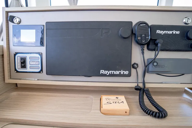 Tide Together Yacht Photos Pics Control panel of 2023 Lagoon 42 catamaran with Raymarine equipment and GenSet switch.