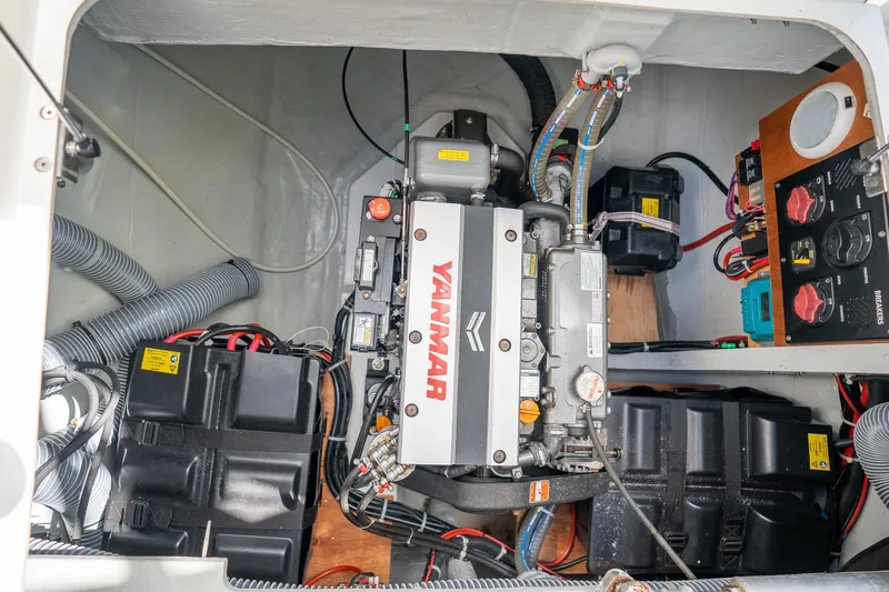 Tide Together Yacht Photos Pics Engine compartment of 2023 Lagoon 42 catamaran with Yanmar engine and electrical components.