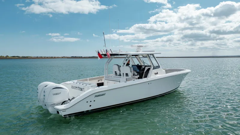 Mindy's Tyde III Yacht Photos Pics 2022 Pursuit S 328 boat on calm water under a partly cloudy sky.