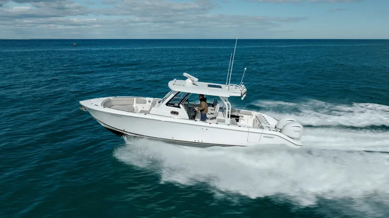 Mindy's Tyde III Yacht Photos Pics 2022 Pursuit S 328 boat cruising on open water.