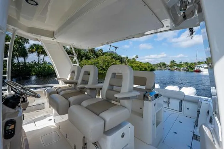 Aj Yacht Photos Pics 2020 Boston Whaler 420 Outrage interior with luxurious seating and scenic water view.