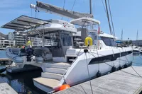 2022 Leopard 50 catamaran docked at marina, featuring modern design and spacious deck.