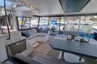 Luxurious Leopard 50 yacht interior, 2022 model, featuring spacious seating and elegant dining area.