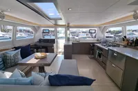 Luxurious interior of 2022 Leopard 50 yacht with modern kitchen and seating area.