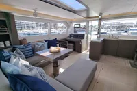 Luxurious interior of 2022 Leopard 50 yacht with modern furnishings and marina view.