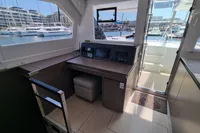 Modern Leopard 50 yacht interior with navigation station, marina view, and sleek design, 2022 model.