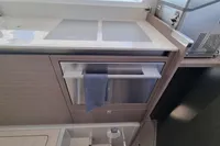 Modern kitchen interior of 2022 Leopard 50 yacht with sleek cabinetry and appliances.