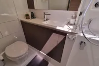 Modern bathroom in a 2022 Leopard 50 yacht with sleek fixtures and elegant design.