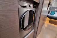 Modern laundry area in a 2022 Leopard 50 yacht, featuring an LG washer-dryer.
