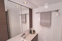 Modern bathroom interior in Leopard 50, 2022 model, featuring sleek design and elegant fixtures.
