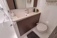 Modern bathroom in 2022 Leopard 50 yacht with sleek fixtures and compact design.