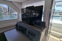 Interior of 2022 Leopard 50 yacht with TV and marina view.