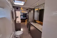 Luxurious bathroom interior of 2022 Leopard 50 yacht, featuring modern fixtures and elegant design.