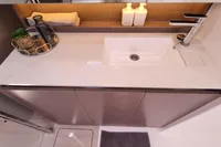 Modern bathroom sink in a 2022 Leopard 50 yacht, featuring sleek design and accessories.