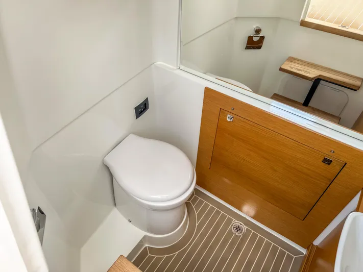  Yacht Photos Pics Modern bathroom interior of 2024 De Antonio Yachts D28 Open, featuring sleek design and wooden accents.