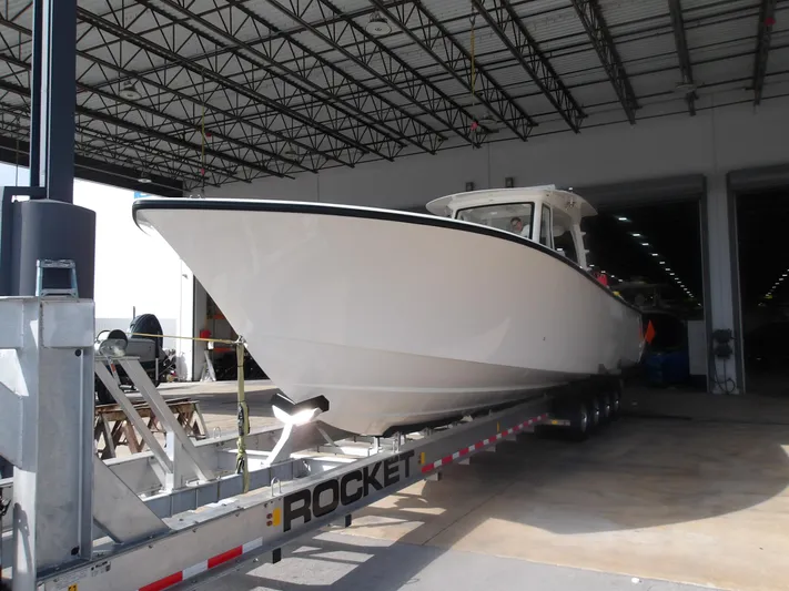  Yacht Photos Pics 2025 SeaVee 420Z boat on trailer in warehouse setting.
