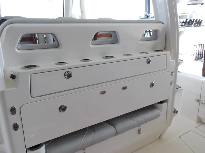  Yacht Photos Pics 2025 SeaVee 420Z boat interior with storage compartments and rod holders.