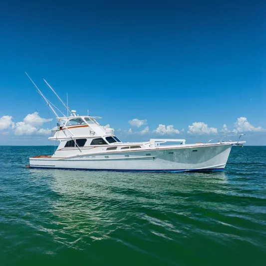Miss Phebe II Yacht Photos Pics 1971 Whiticar 62 Convertible yacht on open sea under clear blue sky.