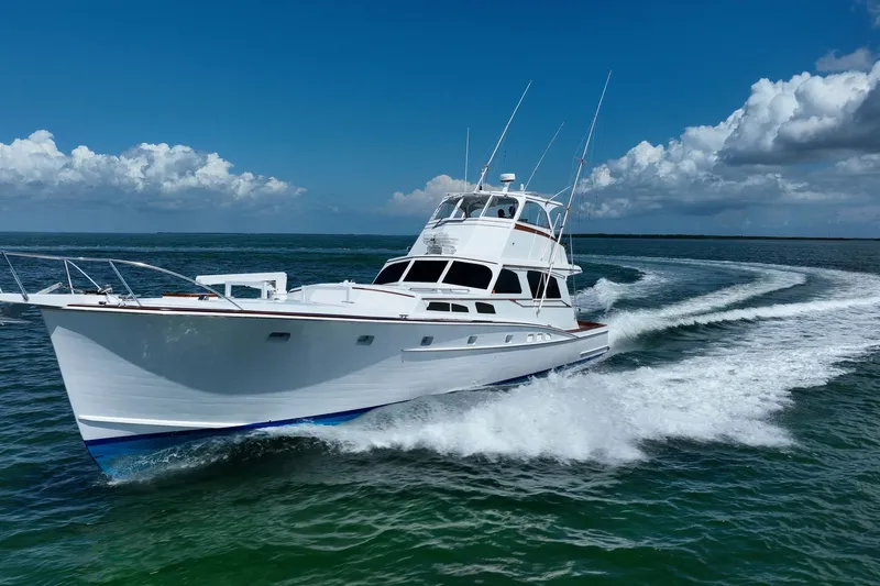 Miss Phebe II Yacht Photos Pics 1971 Whiticar 62 Convertible yacht cruising on open water under clear skies.