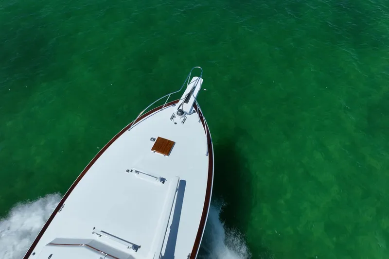 Miss Phebe II Yacht Photos Pics Aerial view of 1971 Whiticar 62 Convertible yacht cruising in clear green waters.