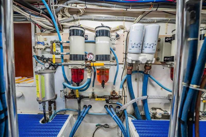 Miss Phebe II Yacht Photos Pics Engine room of 1971 Whiticar 62 Convertible with fuel filters and blue hoses.