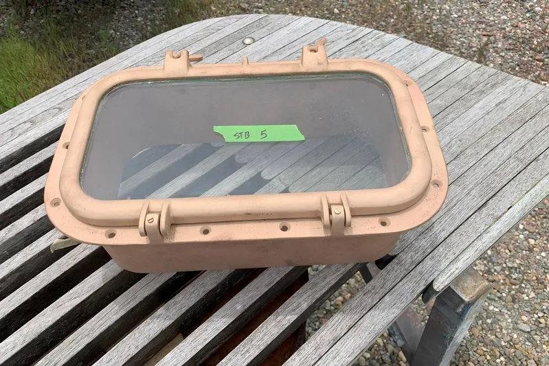 Miss Phebe II Yacht Photos Pics Vintage Whiticar 62 Convertible 1971 boat window on wooden table.