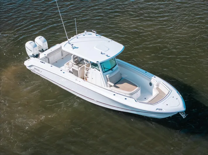 Rock N’ Doc Yacht Photos Pics 2019 Boston Whaler 330 Outrage boat on water, aerial view.