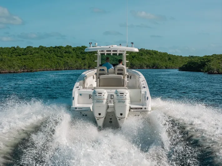 Rock N’ Doc Yacht Photos Pics 2019 Boston Whaler 330 Outrage cruising on a scenic waterway.