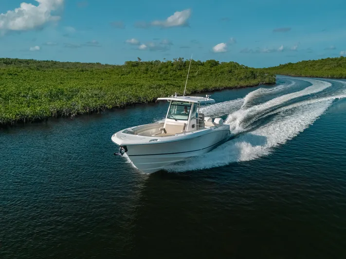 Rock N’ Doc Yacht Photos Pics 2019 Boston Whaler 330 Outrage cruising on a scenic waterway.