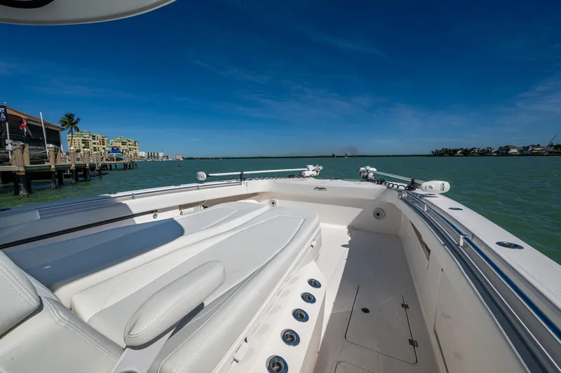 Hoosier Hooker Yacht Photos Pics Invincible 40 Catamaran 2021 on calm waters, showcasing spacious deck and luxurious seating.