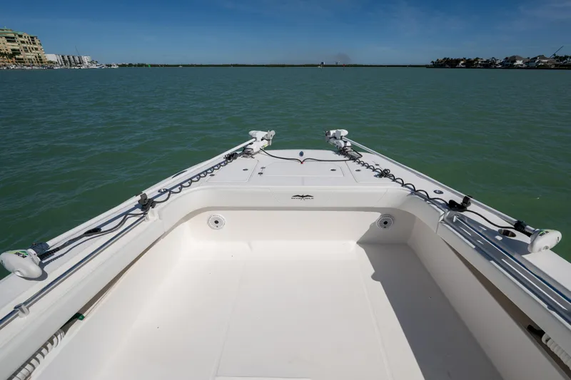 Hoosier Hooker Yacht Photos Pics Invincible 40 Catamaran 2021 on calm waters, showcasing spacious deck and modern design.