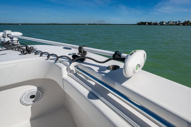 Hoosier Hooker Yacht Photos Pics 2021 Invincible 40 Catamaran bow with trolling motor on calm water.