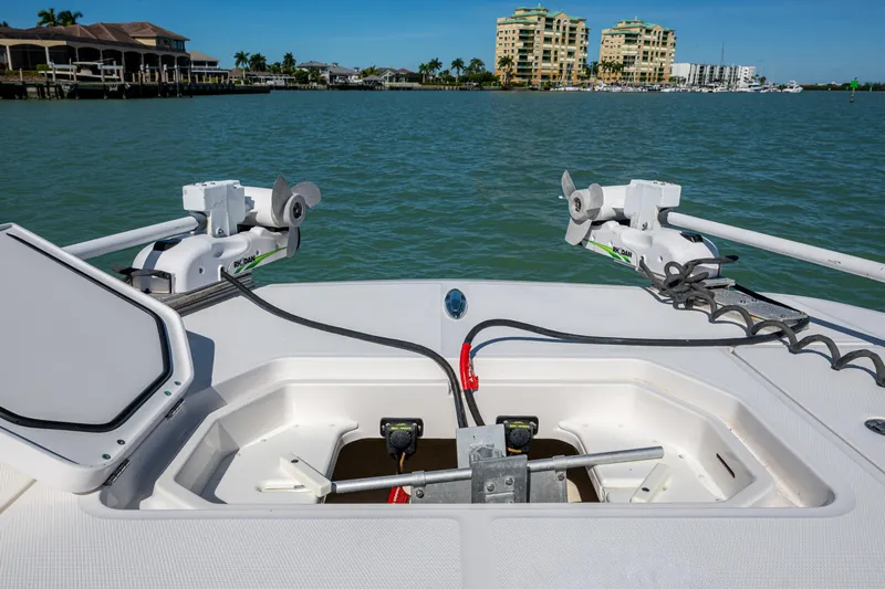 Hoosier Hooker Yacht Photos Pics 2021 Invincible 40 Catamaran deck with open storage compartments and scenic waterfront view.